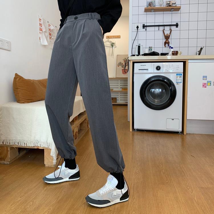 RILVA High Waist Loose Straight Leg Wide Leg Trousers worn with stylish sneakers in a home setting.