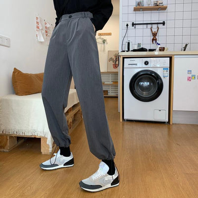 RILVA High Waist Loose Straight Leg Wide Leg Trousers worn with stylish sneakers in a home setting.