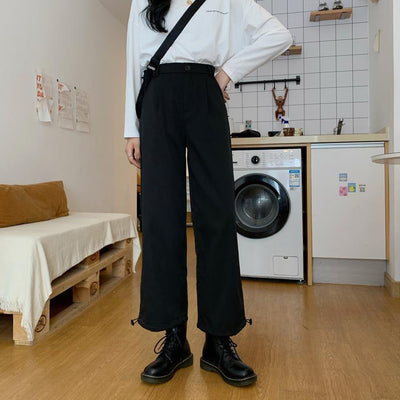 RILVA High Waist Loose Straight Leg Wide Leg Trousers styled with a white shirt and black boots in a modern kitchen.